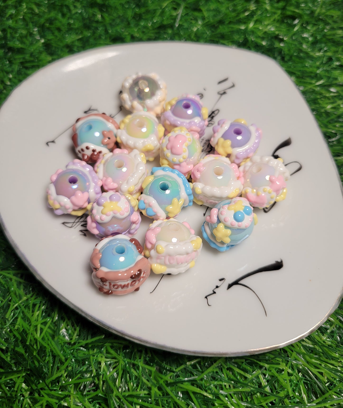 Rhinestone and hand painted beads.